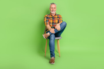 Sticker - Full body photo of funky old beard man sit wear shirt jeans footwear isolated on green color background