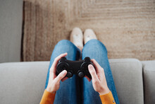 Woman Playing Game With Joystick At Home