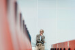© Westend61 - Businesswoman with hand on chin at auditorium seats