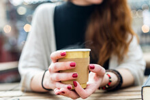 Woman With Painted Nails Holding Disposable Coffee Cup