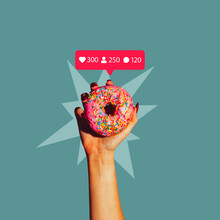 Creative Design. Contemporary Art Collage Of Female Hand Holding Donut With Instagram Likes, Followers And Comments Icons