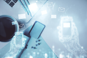 Poster - Envelop hologram drawing over computer on the desktop background. Top view. Double exposure. Technology concept.
