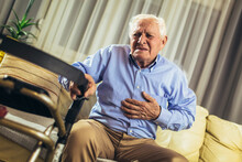 Senior Man With Chest Pain Suffering From Heart Attack At Home
