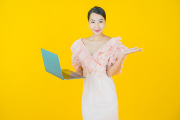 Wall Mural - Portrait beautiful young asian woman smile with computer laptop