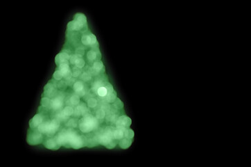 Wall Mural - blurred outlines of a christmas tree on black background
