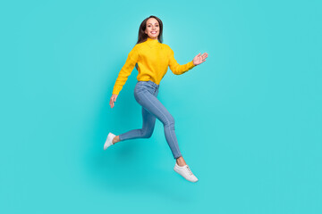 Sticker - Full length body size view of attractive cheerful thin girl jumping running isolated over vivid teal turquoise color background