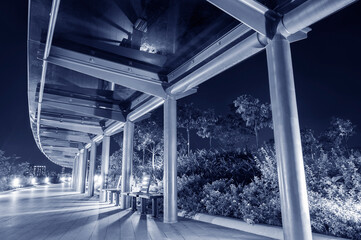 Poster - Empty modern pedestrian walkway in park at night