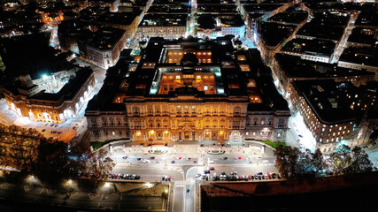 Wall Mural - Aerial drone night shot from illuminated Cassation court Palace of justice, the highest supreme court of Italy next to famous piazza Cavour, Rome historic centre