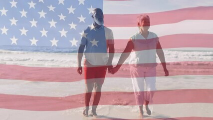 Canvas Print - Animation of happy senior african american couple walking at beach over american flag