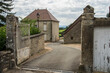 road with old houses and walls in the ancient village of Vareilles in the region Brionnais in France