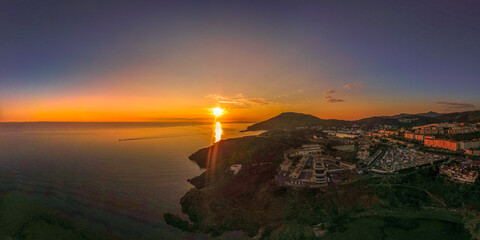 Lever du jour à Port Vendres sur la côte Vermeille,sunrise viewed from drone upon the rocky coast 