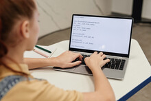 High Angle Portrait Of Teenage Girl Using Laptop And Coding In Programming School For Children, Copy Space