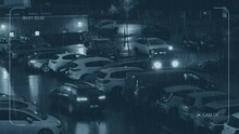 CCTV Busy Parking Lot On Rainy Night