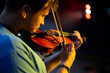 © Hennadii - A man plays the violin on the stage of close