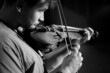 © Hennadii - A man plays the violin on the stage of close