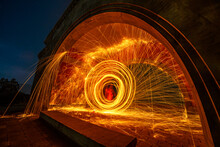 Still Wool Fire Show Under Old Arch In The Night.