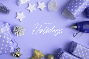 Wall Mural - happy holidays text with christmas and new year gifts wrapping with decor and copy space in very per