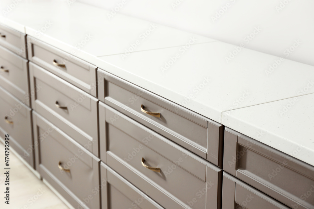 Modern kitchen drawers in light room
