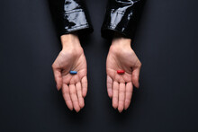 Hands With Blue And Red Pills On Dark Background. Concept Of Choice
