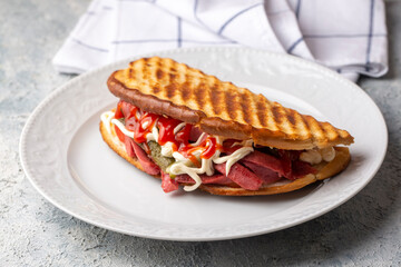 serving turkish traditional toast sandwich (turkish name; ayvalik tostu)