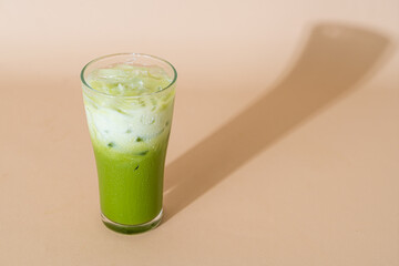 Wall Mural - iced matcha green tea latte in glass