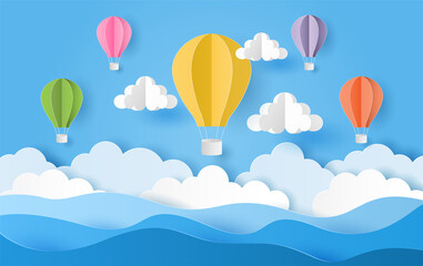 Paper cut style of colorful hot air balloons and cloud over the sea with blue sky. Vector illustration