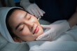 young Asian woman making cosmetology treatment skin injection, Mesotherapy of face beauty care