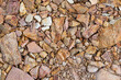 Large crushed stone for road construction close-up. Red rubble paving background.