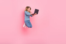 Full Size Profile Side Photo Of Youth Girl Use Laptop Type Email Project Courses Jump Isolated Over Pink Color Background