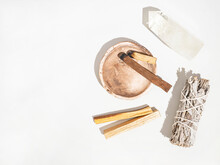 Items For Spiritual Cleansing - Sage Bundle, Palo Santo Incense Sticks And Quartz Crystal On White Background.