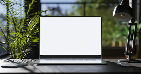 Poster - Laptop with blank frameless screen mockup template on the table in industrial office loft interior - front view