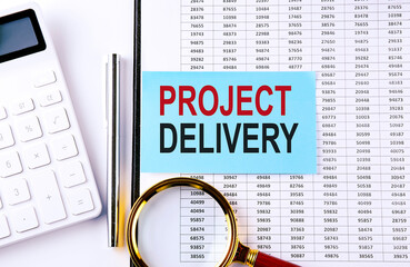 Poster - PROJECT DELIVERY text on sticker on chart background, business concept
