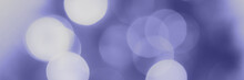 Trendy Very Peri Color Of The Year 2022, Violet Blue Blurred Lights Background. Abstract Defocused Bokeh Header With Soft Light. Wide Screen Wallpaper. Panoramic Web Banner With Copy Space For Design