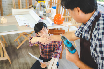 Wall Mural - wooden workshop concept, carpenter team craftsman person working with a wood work construction tool