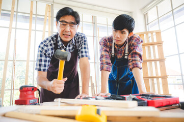 Wall Mural - wooden workshop concept, carpenter team craftsman person working with a wood work construction tool