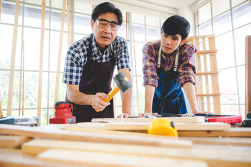 Wall Mural - wooden workshop concept, carpenter team craftsman person working with a wood work construction tool