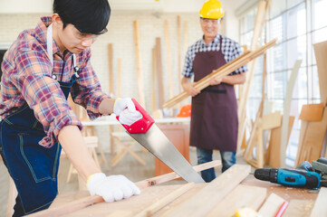 Wall Mural - wooden workshop concept, carpenter team craftsman person working with a wood work construction tool