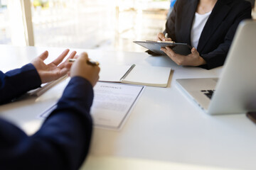 Wall Mural - Insurance agents are discussing with customers. Business people meeting to negotiate the signing of the contract.