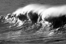 Angry Wave Breaking On Shore Black And White.