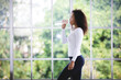 © chokniti - African American woman are workout exercise and drinking a water at fitness gym