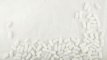 Styrofoam Packing Peanuts  Background. White Plastic Foam Pellets Protective For Parcel Packing.