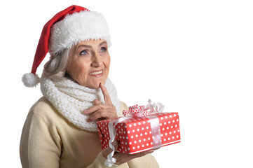 Canvas Print - Portrait of smiling senior woman in Santa hat posing