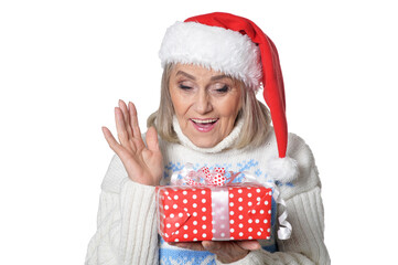 Canvas Print - Portrait of smiling senior woman in Santa hat posing