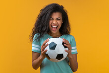 Portrait Of Football Fan Girl With The Ball In Hands Smiling And Saying "yeah", Being Happy To Support Favorite Team
