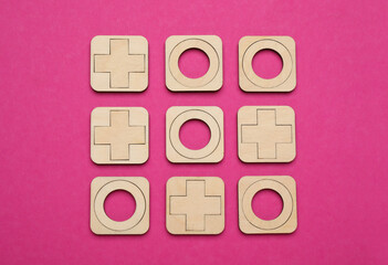 Poster - Tic tac toe set on bright pink background, flat lay