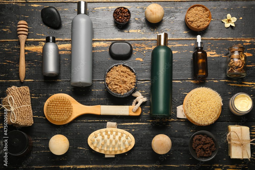 Different natural cosmetics and spa accessories on dark wooden background