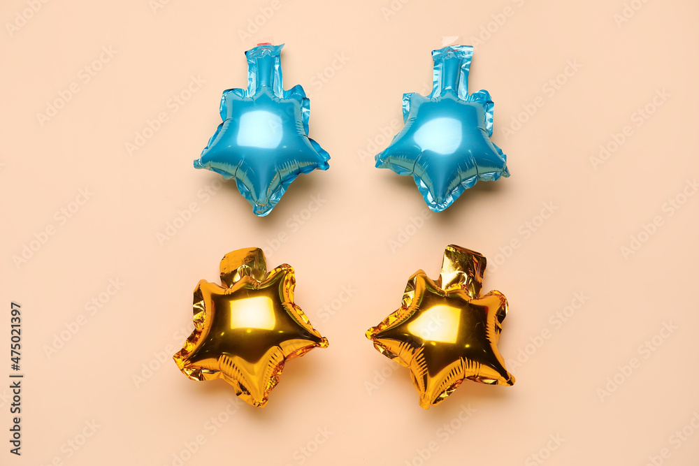 Beautiful different balloons on beige background