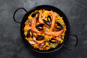 Poster - Seafood Paella on gray background.