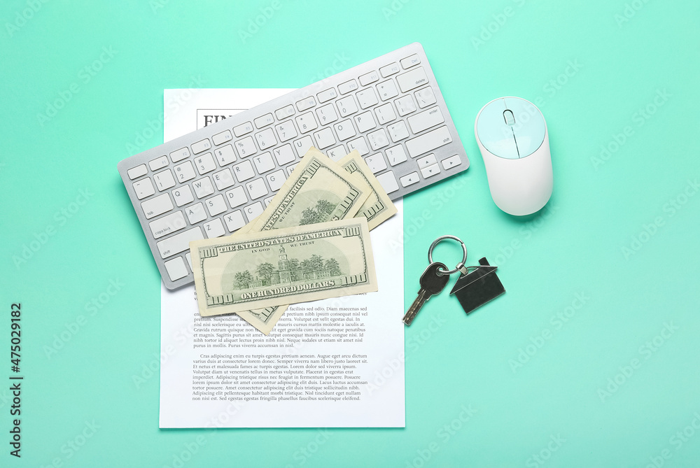 Key from house with money and computer keyboard on turquoise background
