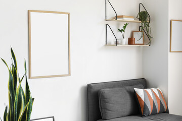 Blank poster in interior of light living room